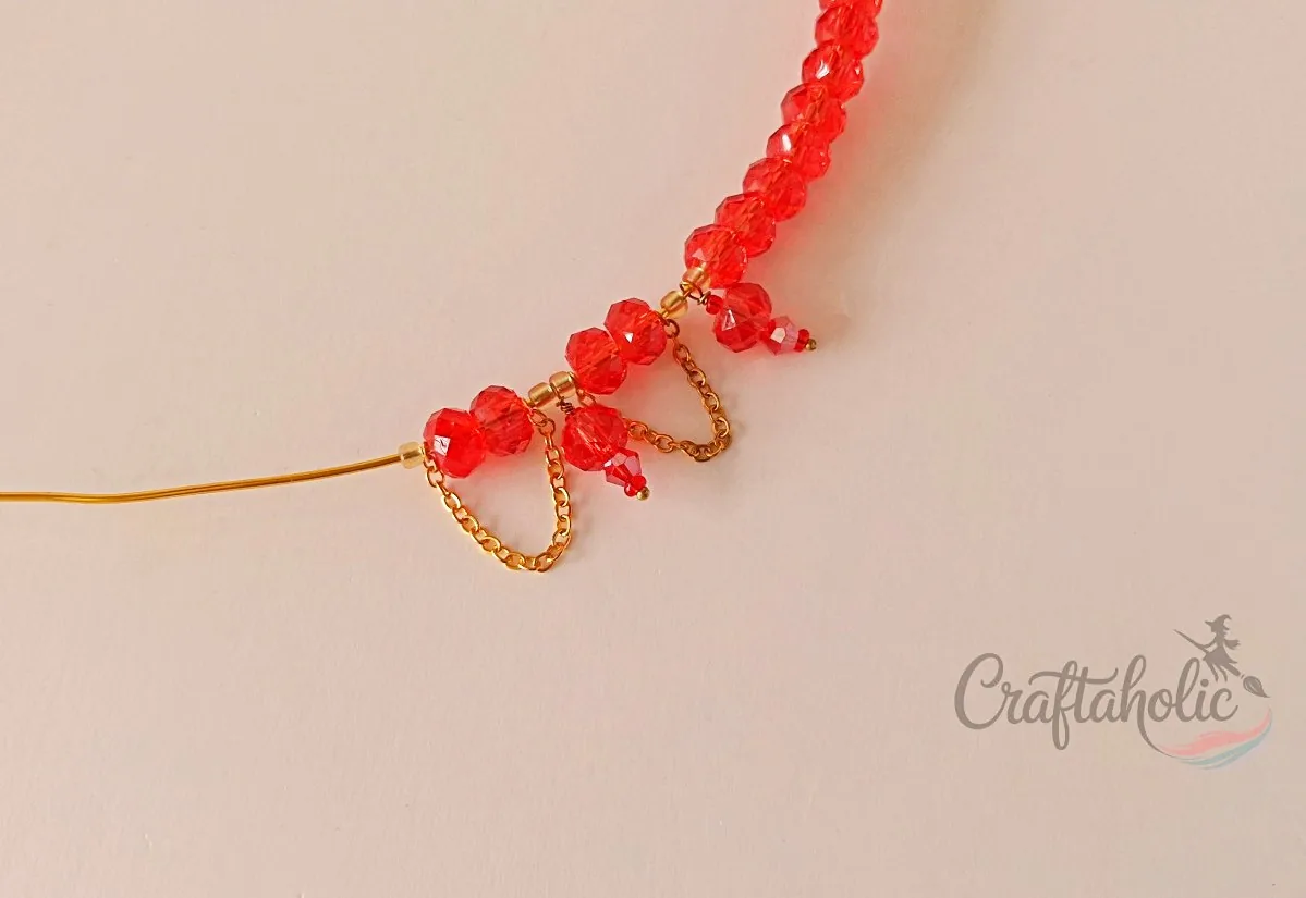 Beaded choker necklace, step 12 Continuing to add bead charms along the choker base