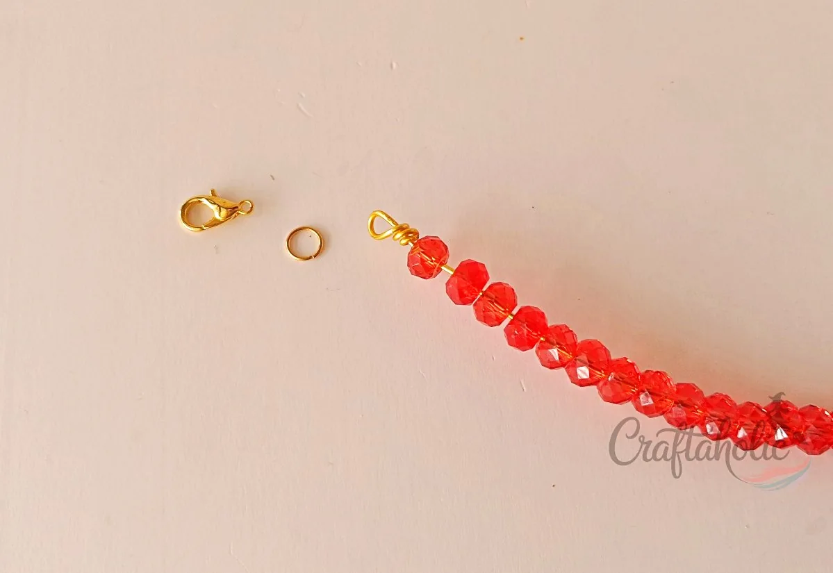 Beaded choker necklace, step 15 Securing the base wire by coiling a loop at the end
