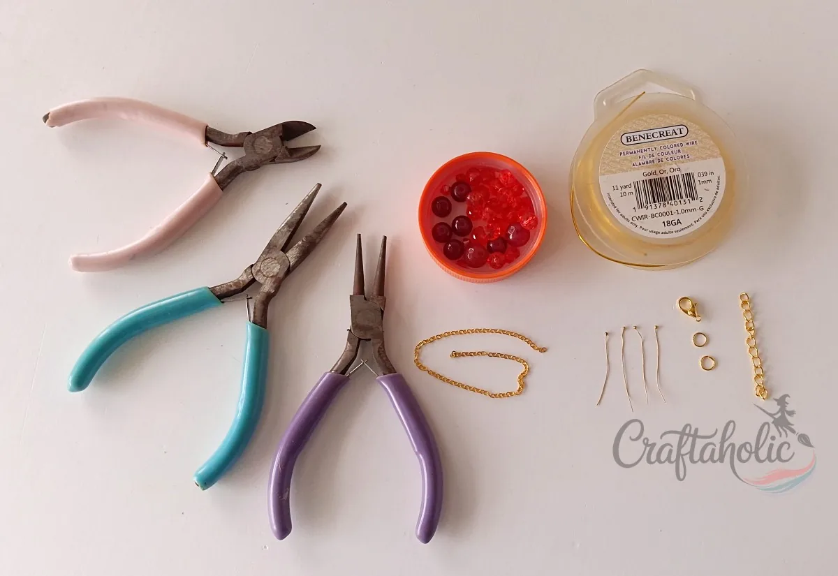 Beaded choker necklace supplies laid out Supplies for making a beaded choker necklace: pliers, wire, beads, chain, and clasp