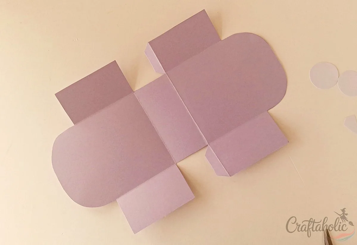 Tracing and cutting the monster snack box template from cardstock