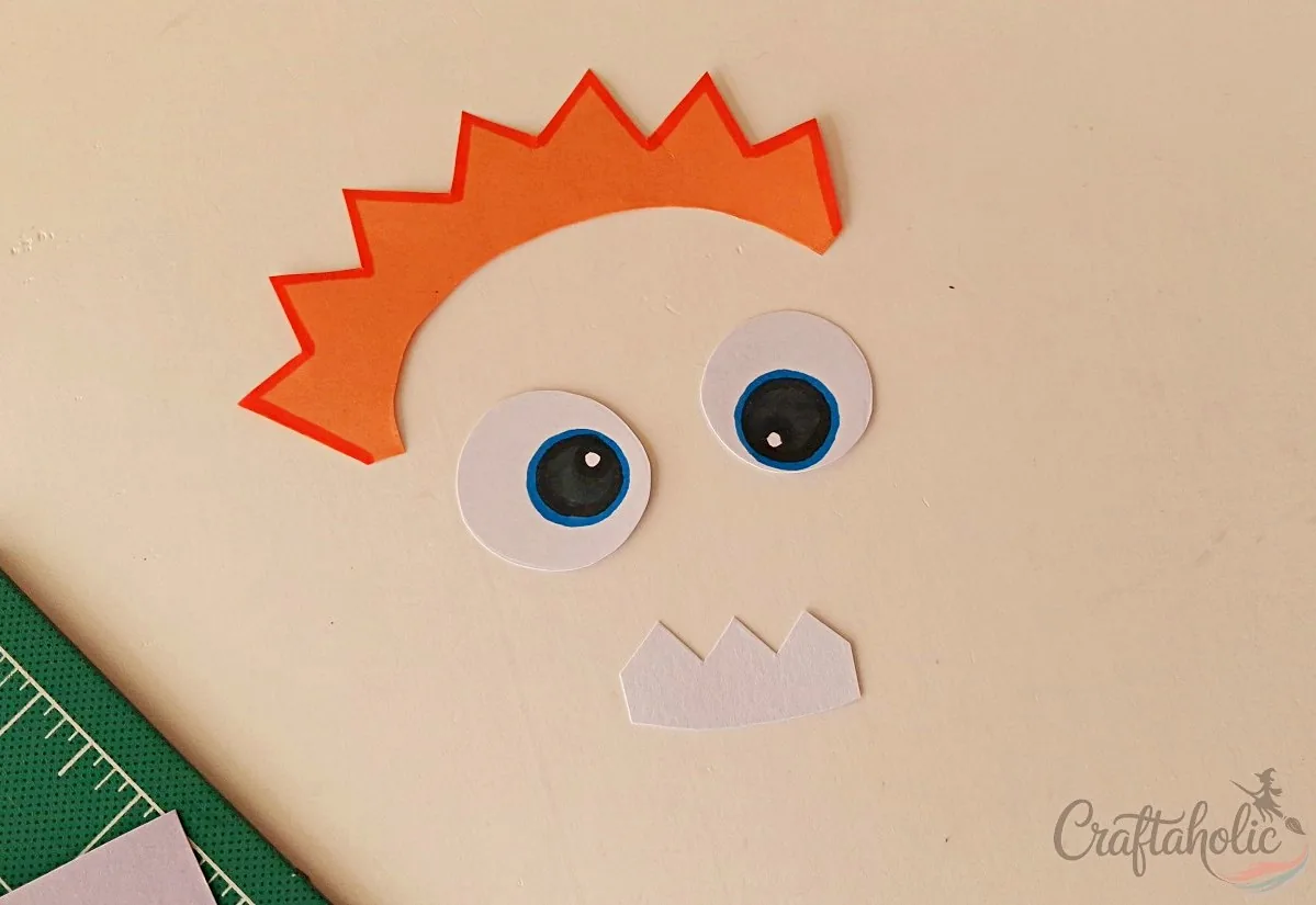 Preparing the monster parts for the snack box from craft paper
