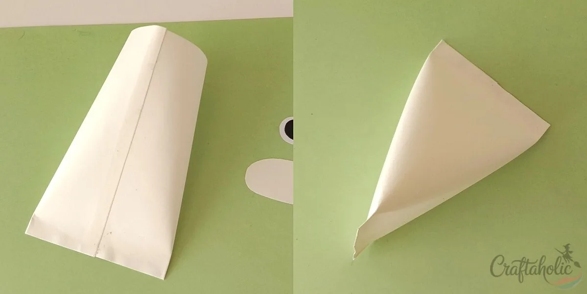 Ghost treat box, step 3: gluing the sides Gluing both sides of the ghost treat box to form the triangle shape