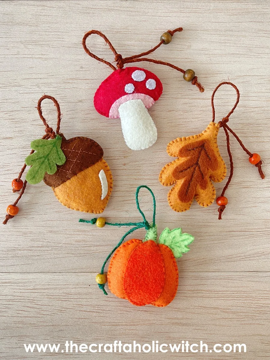 Felt fall ornament set Handmade felt fall ornaments with beaded hanging loops: an acorn, mushroom, leaf and pumpkin