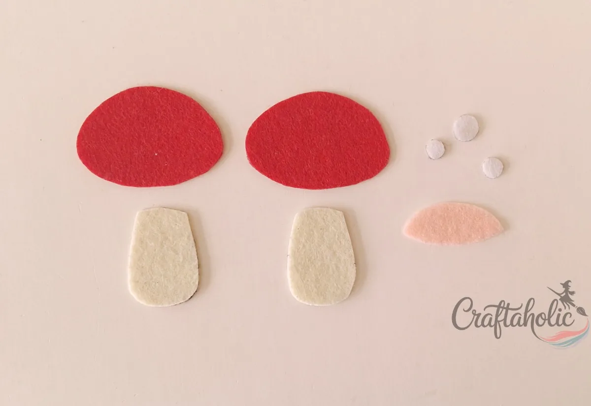 Felt mushroom ornament, step 1 Felt cutouts for the mushroom cap, stalk, dots and gills traced from the template