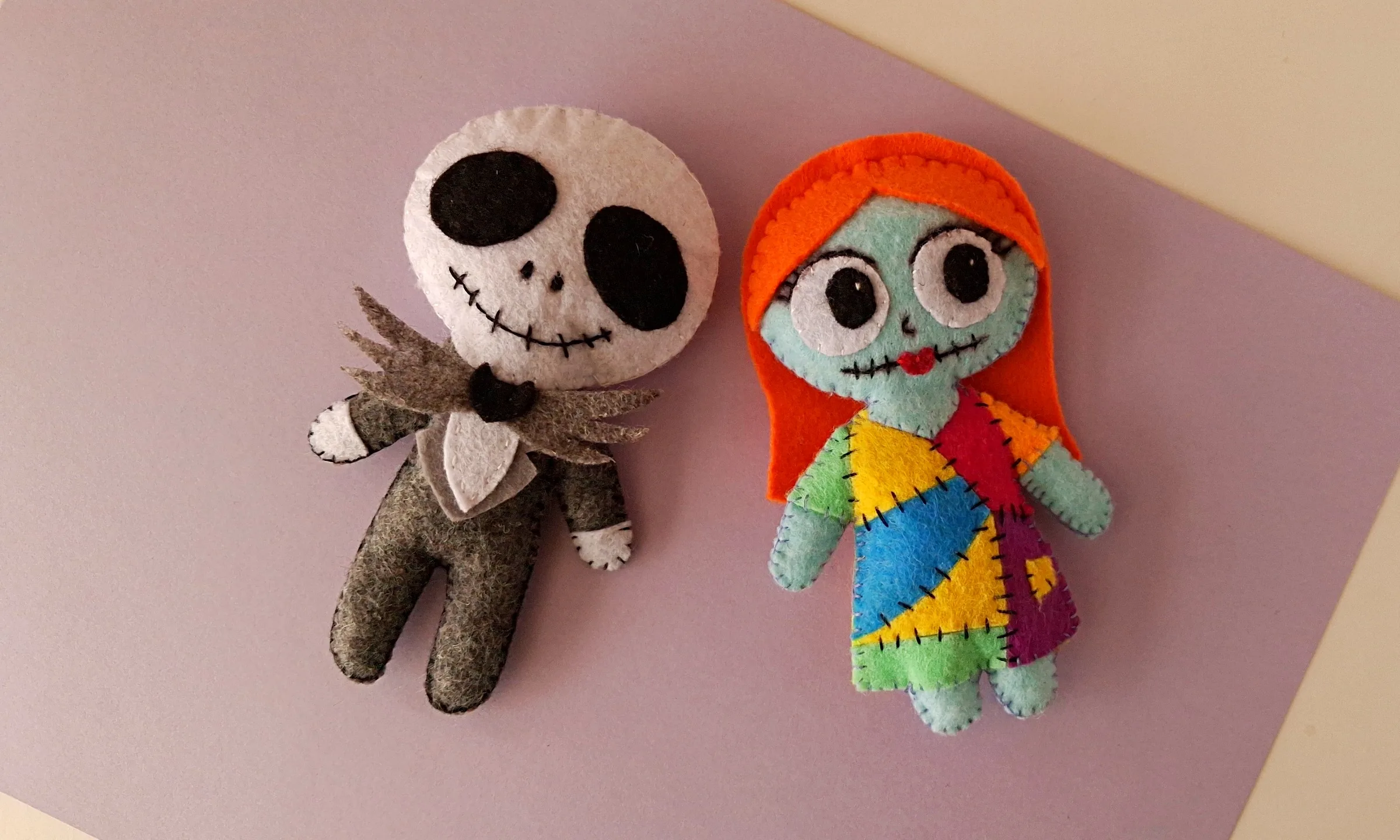 Jack and Sally felt dolls, finished Finished Jack and Sally felt dolls from The Nightmare Before Christmas laid side by side
