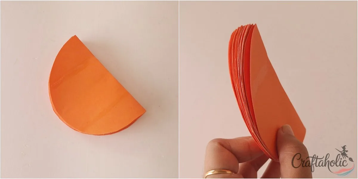 Stack of glued pieces A stack of glued, folded orange paper pieces held on its edge