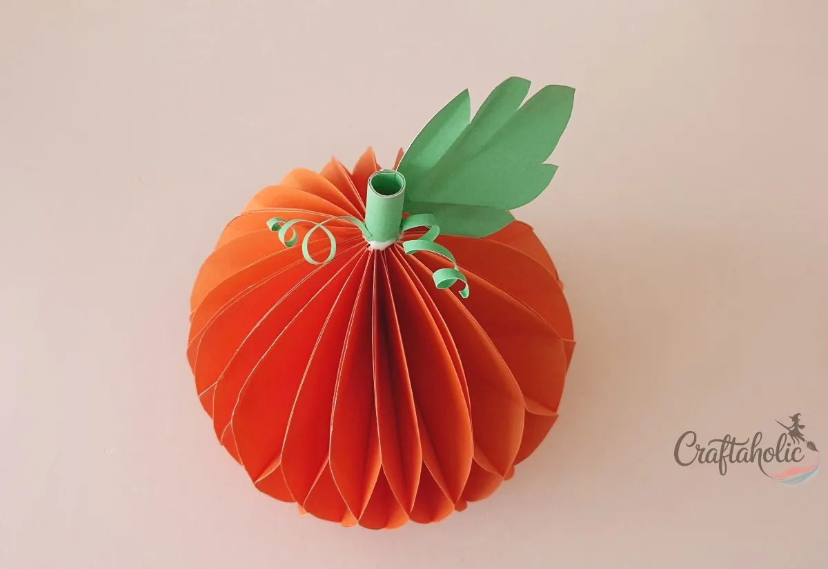 Finished pumpkin Finished honeycomb paper pumpkin with a green paper stem, curled vine and leaf on top